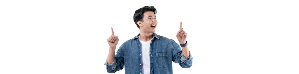 A man in a blue shirt is pointing up with his hands