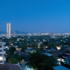 Naklejka premium Night Cityscape Urban Skyline Illuminated Buildings Twilight Panorama