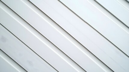 Obraz premium A minimalist background of soft diagonal lines in alternating shades of white and pale gray for a clean layout