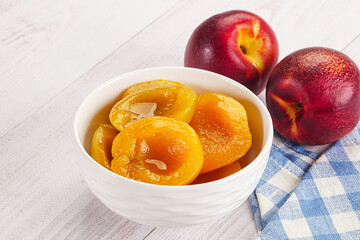Canned peaches with sweet syrope