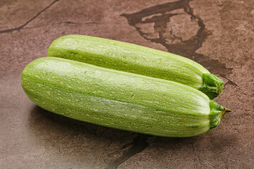 Raw green ripe zucchini vegetable