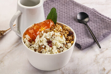 Curd with granola and orange jam