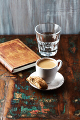 Cup of coffee and Cantuccini (Italian cookie) on dark wooden background. Copy space.	