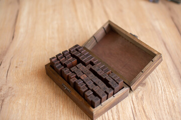 Vintage Wooden Letterpress Blocks in Rustic Box on Table