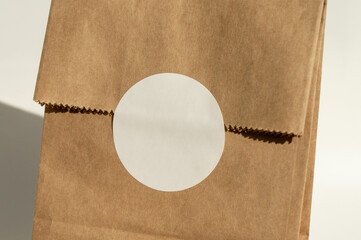 Plain brown paper bag with circular label