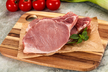 Raw pork steak loin with bone