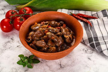 Baked chicken hearts with vegetables