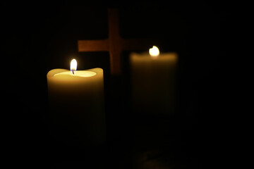 Candlelight and Cross in Darkness - Peaceful Christian Spiritual Symbol
