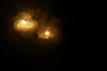 Glowing Candlelight in Darkness with Serene Ambience and Mystical Smoke