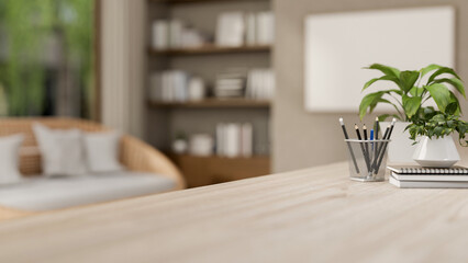 A close-up of a space on a wooden tabletop in a contemporary cozy living room