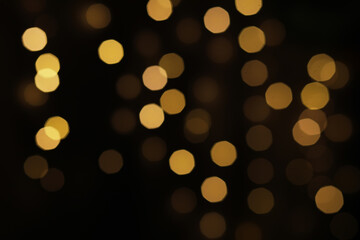 Golden Bokeh Light Pattern - Abstract Festive Background with Blurred Warm Glowing Circles