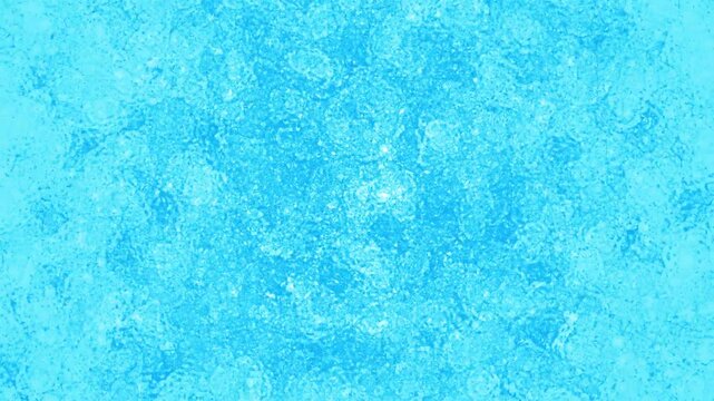 Animated 4k loop background of light blue ice solidifying in the center of the screen at 60 fps