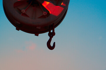 One hanging rope reel on a fishing boat.