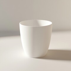 Minimalist design featuring a white, modern cup against a soft, neutral background.