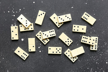 White dominos blocks on black background