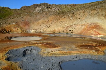the colorful hot springs and mud pots in the volcanic solfatara fields of krysuvik geothermal area in the mountains near harfnarfjordur, south of reykjavik, iceland