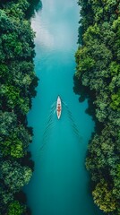 A serene canoe glides through a lush green waterway.