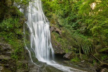 The Cascade d'Autoire waterfall in summer. A 30 meter high waterfall near Autoire in Lot Occitanie Southern France