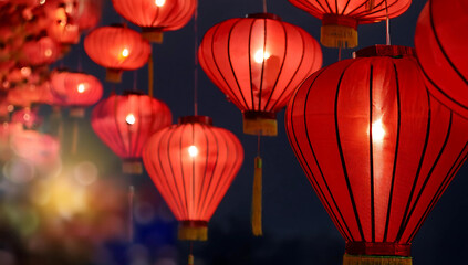 Chinese red lanterns on the night of the happy Chinese New Year decorate the streets.