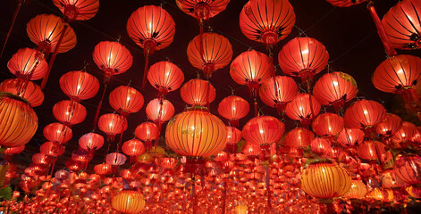 Chinese red lanterns on the night of the happy Chinese New Year decorate the streets.