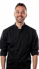 Cheerful chef in black professional uniform against white background