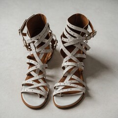 Strappy gladiator sandals, displayed against a white surface.