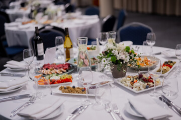 Fine dining event dinner table with bright white cloth