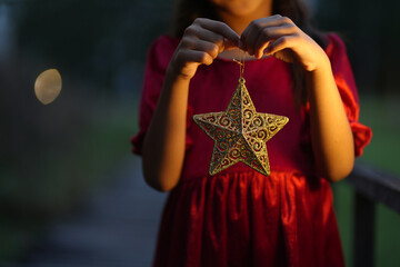 A little girl is happy to join the christmas day.