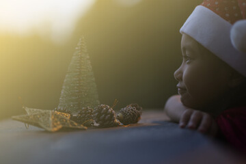 A little girl is happy to join the christmas day.