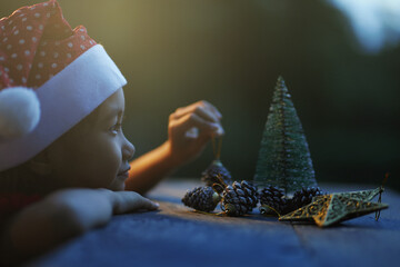 A little girl is happy to join the christmas day.
