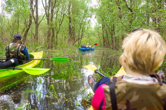 Person Traveller Holding Kayak Paddle While Kayaking On River Outdoors.