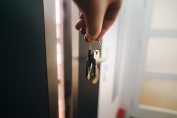 door key hand holding new house real estate market home interior