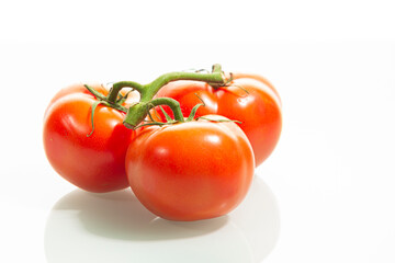 Food Concepts. Small Branch of Red Ripe Romatoes Placed Together Isolated Over Pure White