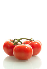 Food Concepts. Small Branch of Red Ripe Romatoes Placed Together Isolated Over Pure White Background