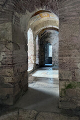 Ruins ancient medieval city old church Lycian rock tombs stone temple in Türkiye, UNESCO World Heritage Site, top arches, keystones, columns, torso statue, corridors, rooms