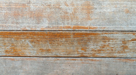 Weathered planked wooden background as a texture