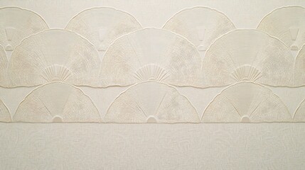 Obraz premium Ornate, light beige, fan-shaped pattern on a wall.
