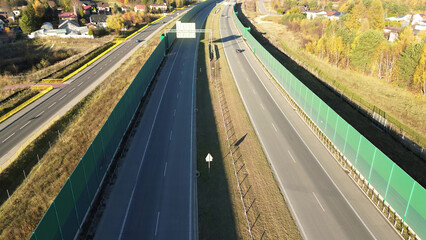Top-down view of highway and green noise barriers