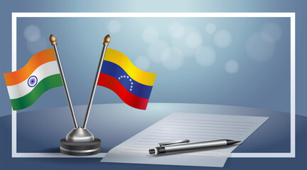 India and Venezuela National flags on small table with bokeh background, cooperative relationship