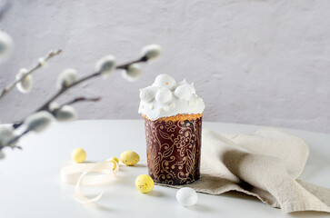Easter cake and holiday decorations on white table. Spring holiday concept.