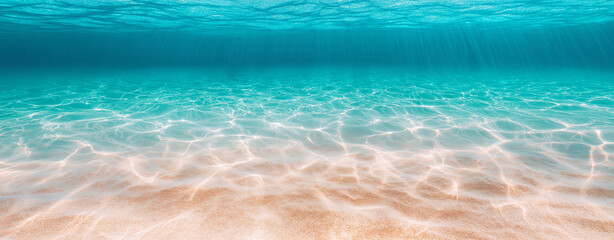 Underwater image ocean  The water appears crystal clear turquoise blue . the sun's rays penetrating the surface underwater landscape,sandy , coastal area or lagoon.