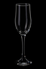 empty champagne flute glass on black background