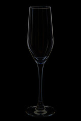 empty champagne flute glass on black background
