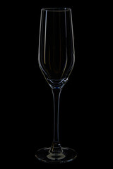 empty champagne flute glass on black background
