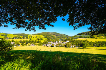 View of the green landscape near Oberhenneborn in the Sauerland. Hiking trails in nature.

