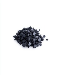 Fototapeta premium Enhancing health with food supplement activated charcoal powder in a neat pile on white background