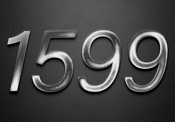 Chrome metal 3D number design of 1599 on grey background.