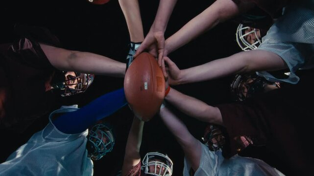 American Football Players Joining Hands in circle Concept of United Team Spirit in Action