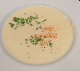 creamy soup in white bowl, Homemade Soup with shopped Parsley on top