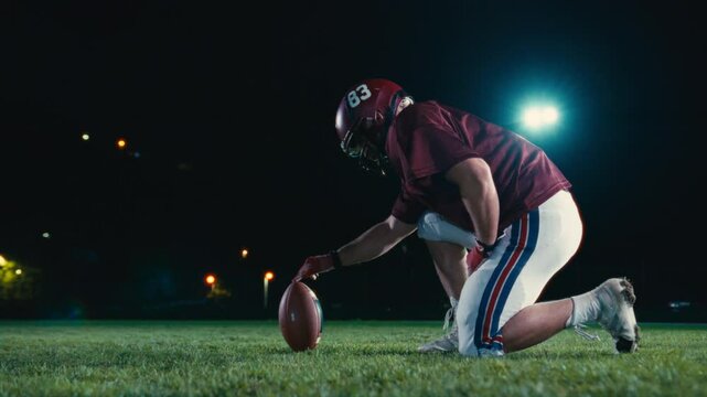 Cinematic shot of American Football player Kickoff Game Start. Static Close-up of Ball Being Kicked by the Professional Player. Gates Goal Kick. Successful Team Scores and Wins Championship.